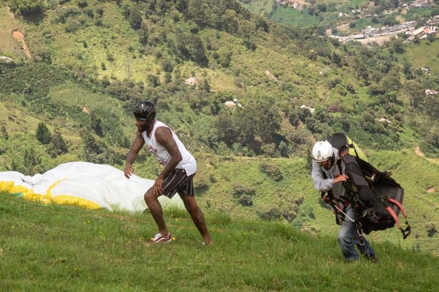 From Medellín: Paragliding Tour with GoPro Photos & Videos - Landing and the trip back