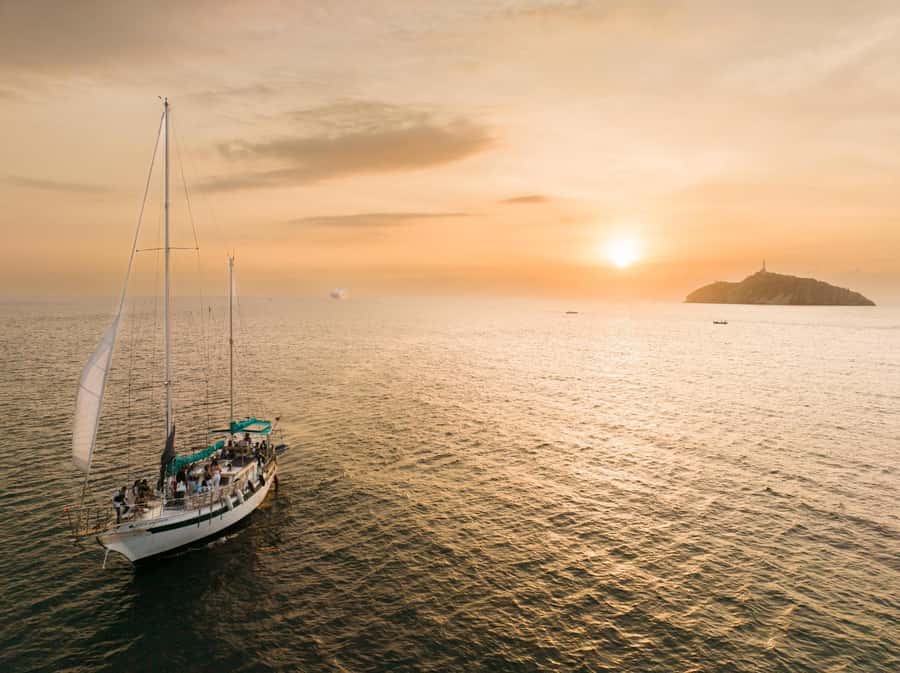 From Santa Marta: Sunset Sailboat Tour with 2 Beverages - Santa Marta’s sunset from the deck