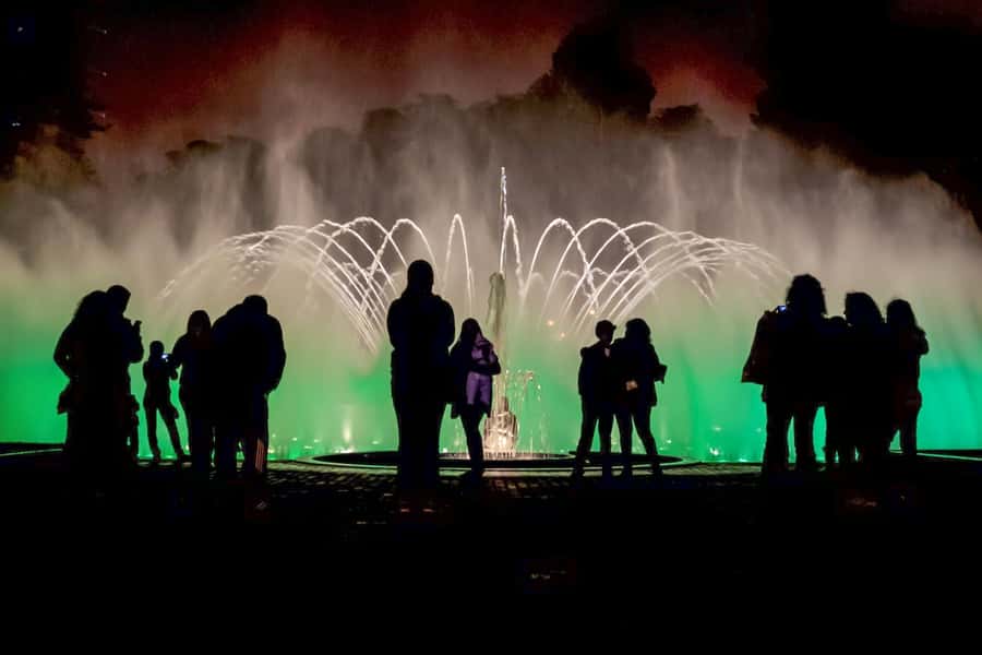 Lima: Water Magic Circuit, Downtown and Catacombs Night Tour - Walking through Lima’s Main Square after dark