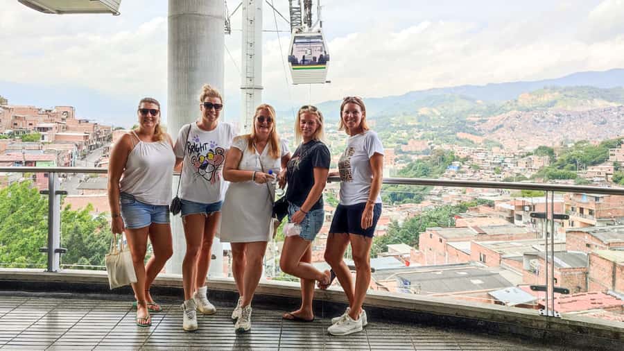 Medellin: Comuna 13 Graffiti Tour, Cable Car & Street Food - An arepa, a view, and a drink