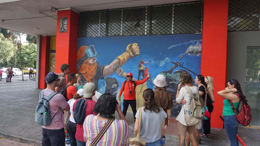 Shared Tour Cali's Salsa, Graffiti & Resistance Experience - Salsa murals beside messages of resistance
