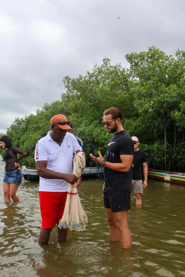 Typical lunch on beach, mangrove tour & fishing with natives - A coconut welcome and the first look at the mangroves